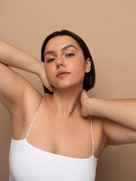 Front view young woman posing in studio