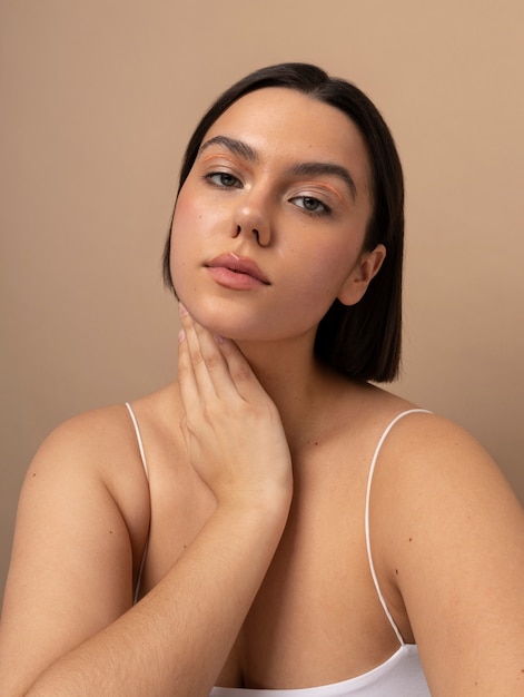 Front view young woman posing in studio