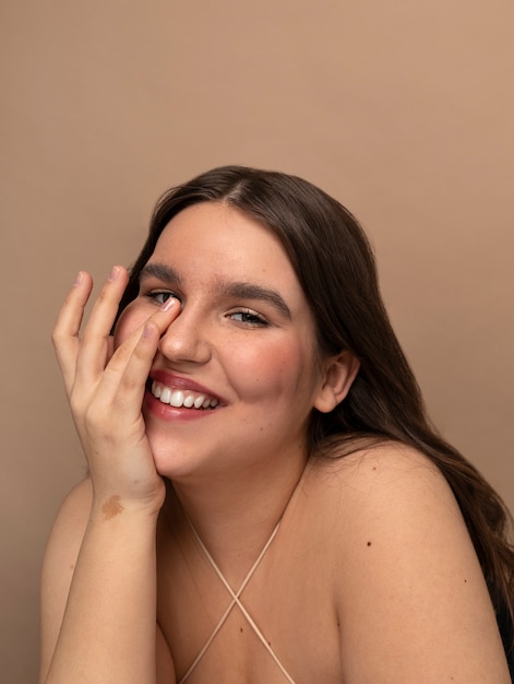 Front view young woman posing in studio