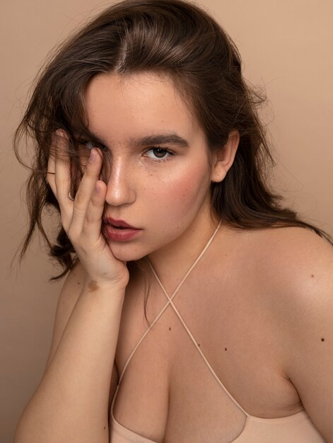 Front view young woman posing in studio