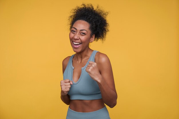 Front view of a young woman preparing to throw a fist