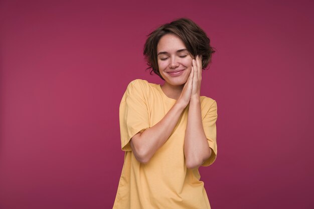 Front view of a young woman pretending to be asleep