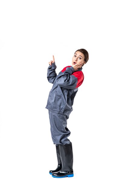 front view of young woman in special uniform on white wall