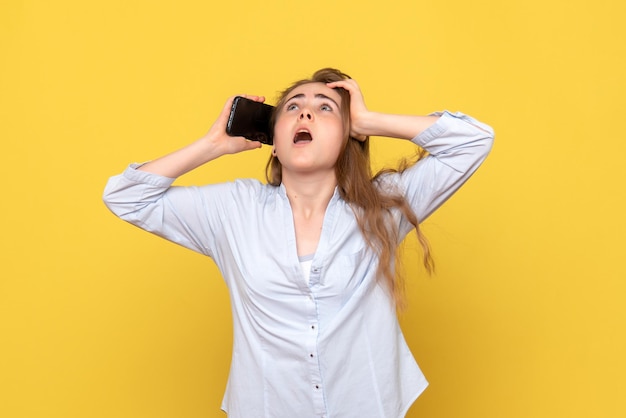 Front view of young woman talking on phone