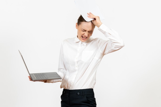 Free photo front view young woman in white blouse holding laptop and documents on white background female job emotions feeling model office