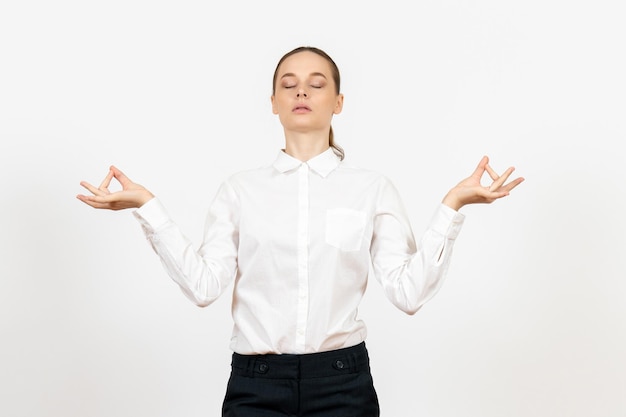 Front view young woman in white blouse with meditation face on white background job office female emotion feeling model