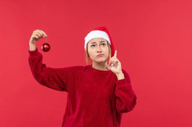 Front view young woman with christmas toy, emotions christmas holiday