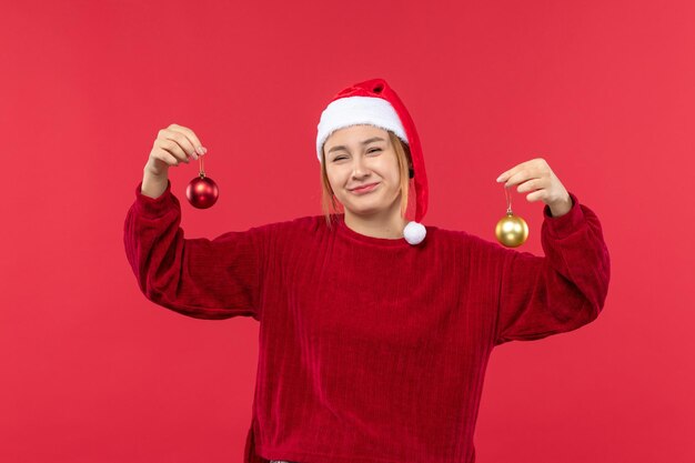 Front view young woman with christmas toys, emotion christmas holiday