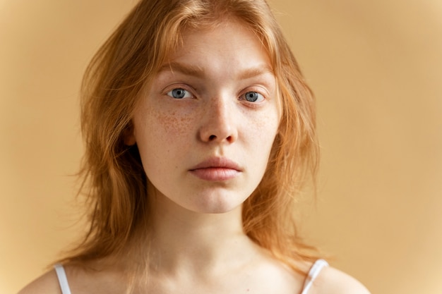 Free photo front view young woman with freckles