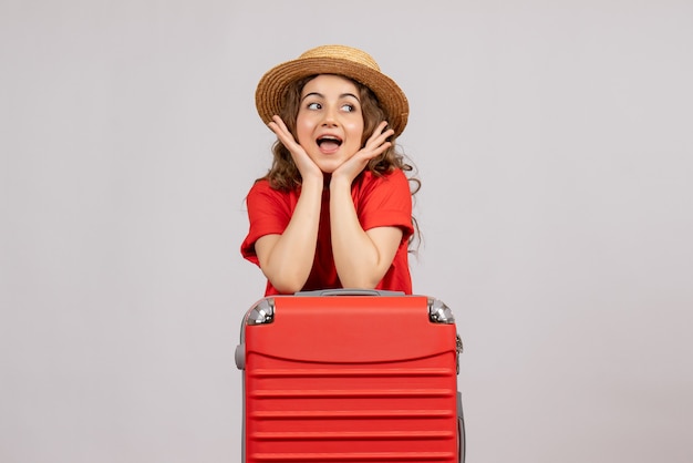 Free photo front view young woman with her valise standing