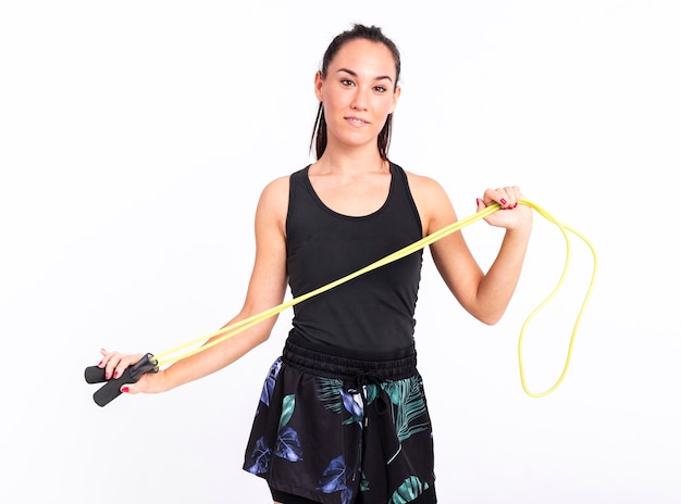 Front view young woman with jumping rope