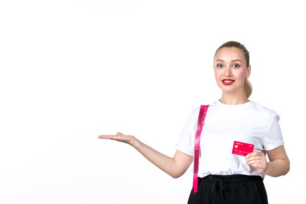 Front view young woman with measure tape and credit card on white surface