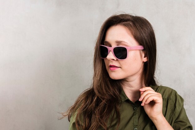 Front view young woman with sunglasses