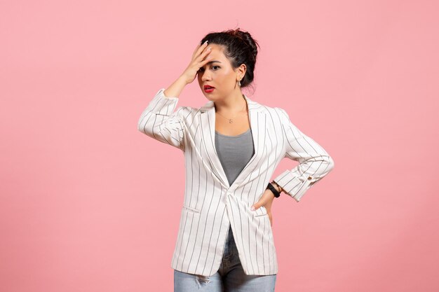 Front view young woman with white jacket on pink background lady emotions fashion woman color feelings