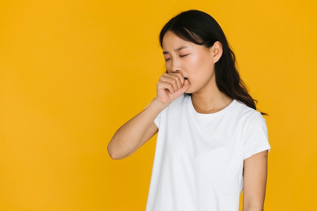 Front view young woman yawning 