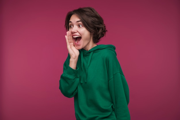 Front view of a young woman yelling