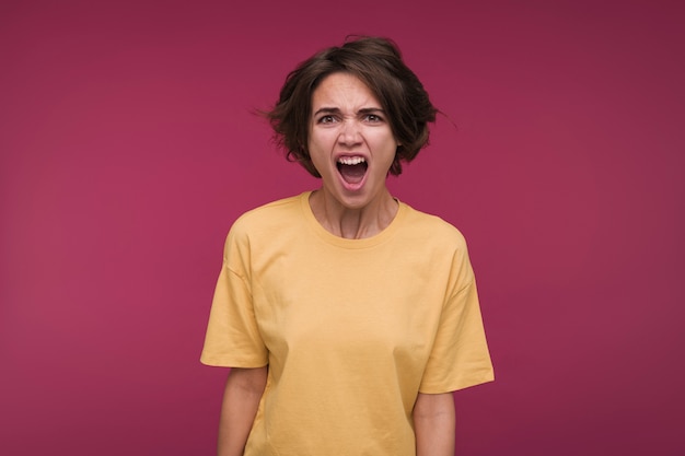 Front view of a young woman yelling