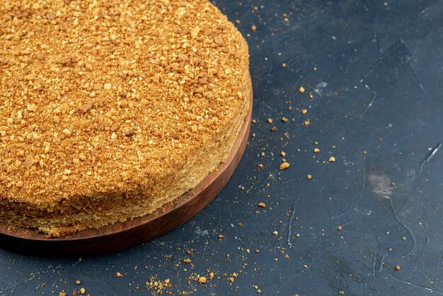 Front view yummy honey cake on a dark background dough sugar cake biscuit sweet bake tea dessert pie