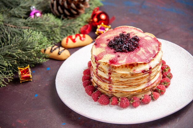 Front view yummy jelly pancakes with fresh strawberries on dark space