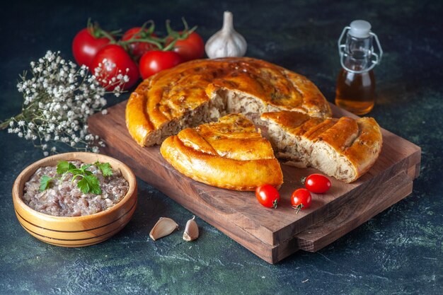 Front view yummy meat pie with greens and tomatoes on dark background biscuit cake food pastry bake dough color pie oven meal