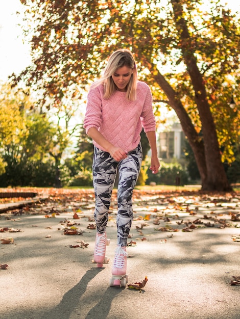 Front of woman in legging roller skating