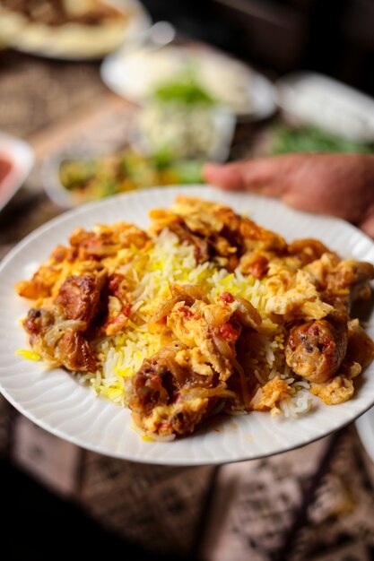 Frontal view traditional azerbaijani chyhyrtma pilaf with chicken