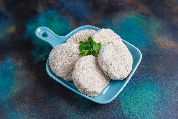 Frozen homemade round cutlets.