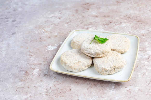 Free photo frozen homemade round cutlets.