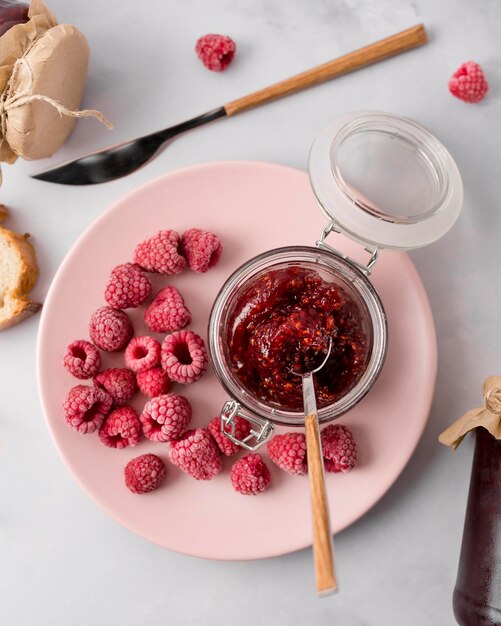 Frozen raspberries jam on plate