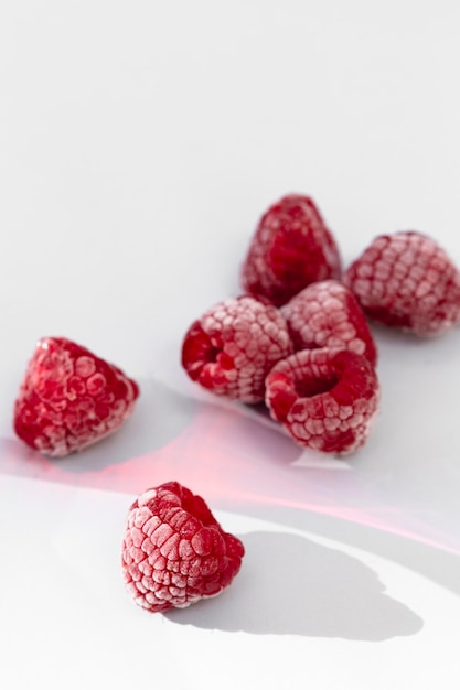 Frozen raspberry on table