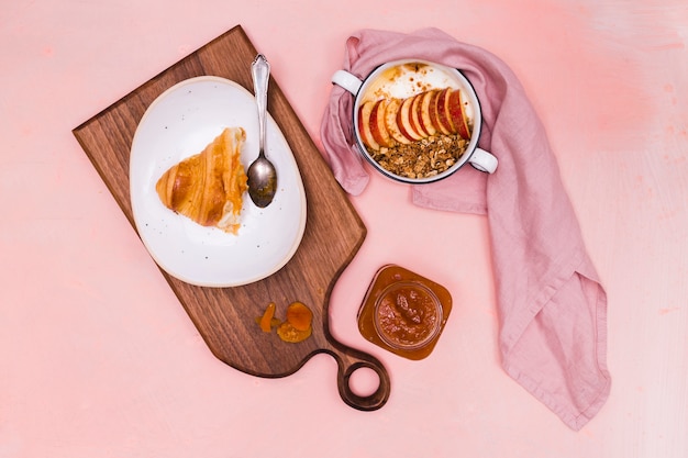 Free photo fruit bowl and croissant top view