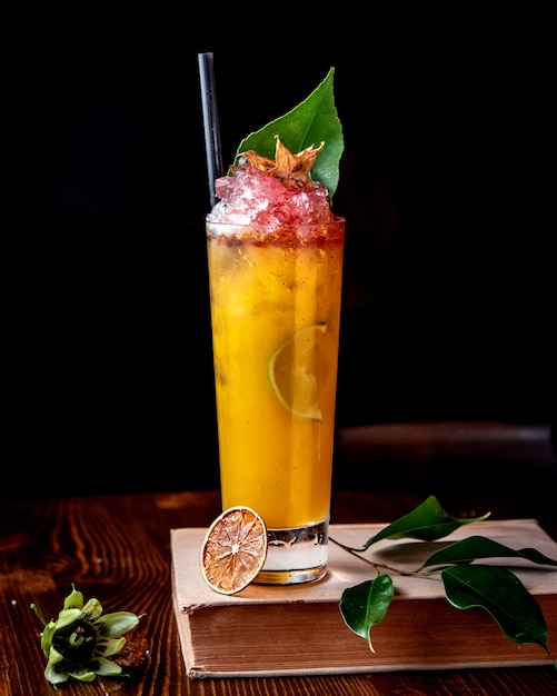Fruit cocktail with ice and green leaf
