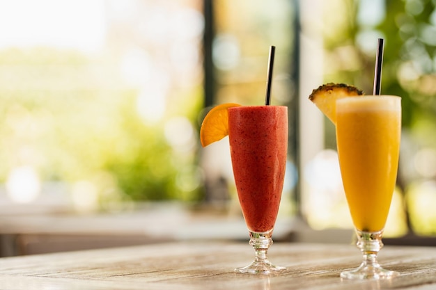 Fruit cocktails in a glass on the table Copy space