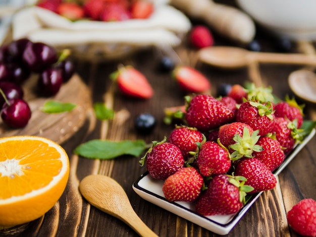 Fruit composition with tasty berries on table