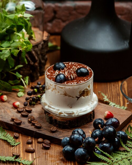 Fruit dessert with cream and sprinkled with cocoa
