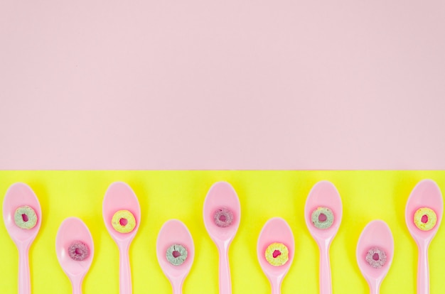 Free photo fruit loop cereals on spoons