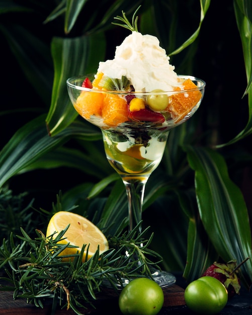 Fruit mix in a glass with cream