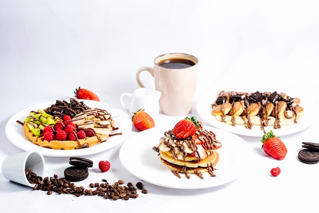 Fruit pancake selection topped with hot chocolate