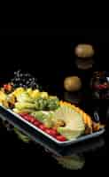 Free photo fruit pltter with mixed summer tropical fruits.