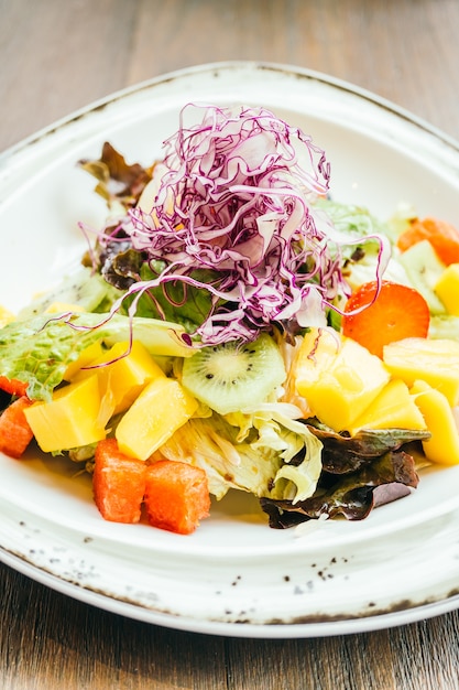 Fruit salad with vegetable in plate