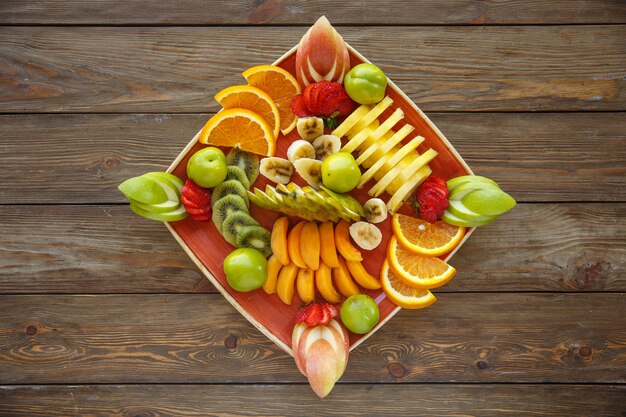 Fruit slices plate with apple, orange, strawberry