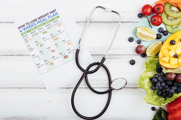 Fruit with lose weight plan and stethoscope 