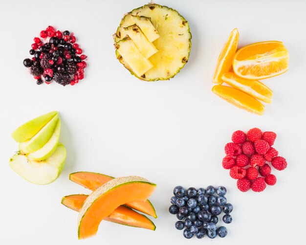 Fruits and berries lying in circle