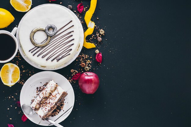 Fruits and coffee near cake