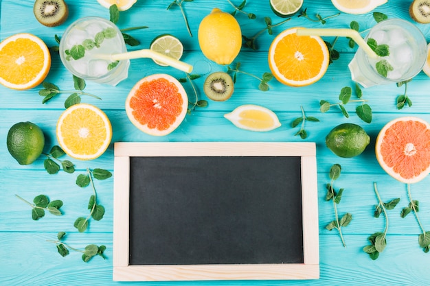 Fruits and drinks near blackboard