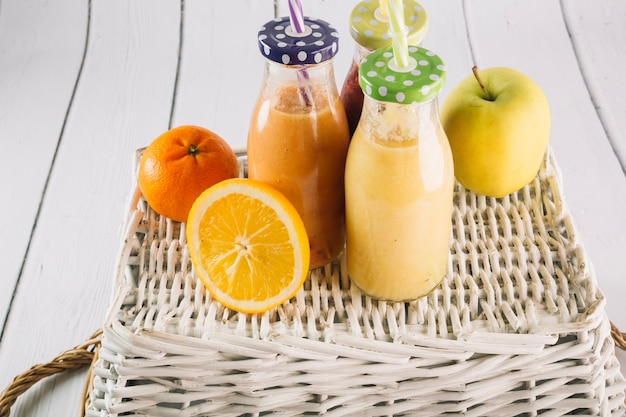 Fruits and smoothie on basket