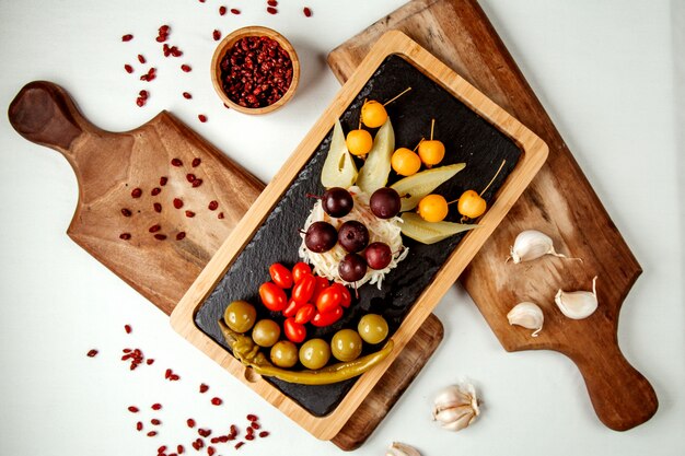 Fruits and vegetables set on wooden board