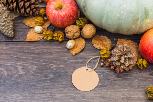 Fruits and vegetables with small paper on table