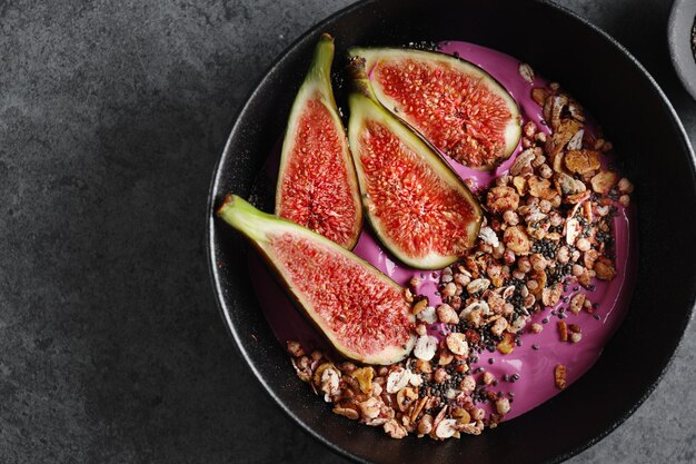 Fruity bowl with muesli granola and figs served in bowl