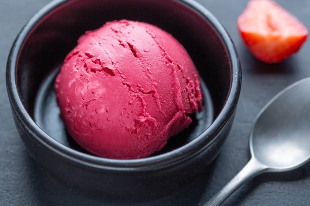 Fruity Strawberry Ice Cream Scoop Served on Plate with Fruits and Pistacchios